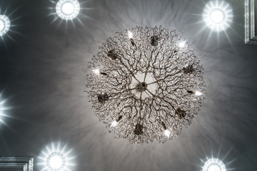 The crystal chandelier on the ceiling is a precious addition to the interior, creating an effect of magic in the evening.