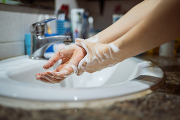 Washing hands in the bathroom