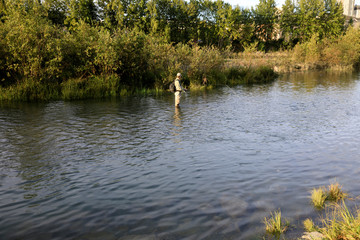 Anchorage, Alaska / USA - August 08, 2019: Fisherman near an Anchorage river, Anchorage, Alaska,  USA