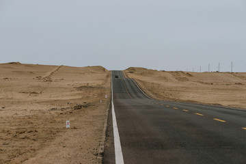 Gobi desert road on vast dry wilderness