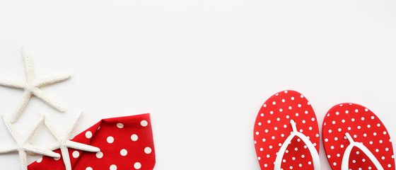 close up of sandals and starfish isolated on white background