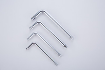 Four steel tools  assembling and assembling furniture on a white background