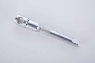 Screwdrivers and angled socket head on a white background