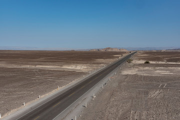 Fototapeta na wymiar Road through the Nazca desert in Peru