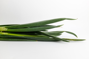 Fototapeta premium Fresh green onions on white background