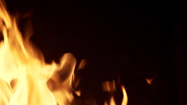flames from close. On the dark background, the right side of the frame is filled. Background. Slow motion