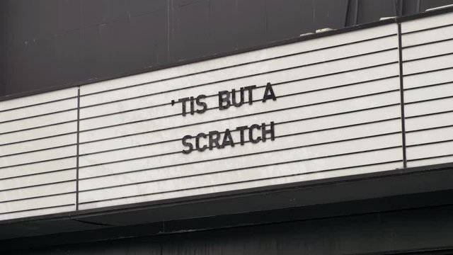 Closed movie theater marquee sign shows signs of hope and positivism, Covid-19