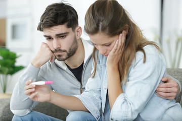 sad couple after negative pregnancy test result