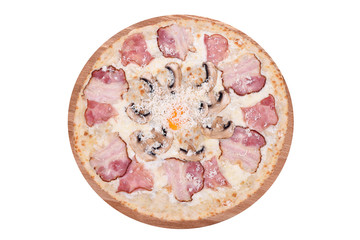 Pizza Carbonara on a wooden platter. Isolated on white. Italian Pizza Carbonara with bacon, egg, champignon and cheese parmesan. View from above.