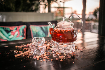 glass of black tea with a spoon