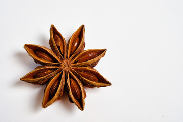Anise stars, Badian on a white background, space for text,lat lay.