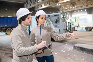 people working in a recycling factory