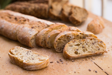 fresh loaf of bread on wooden board