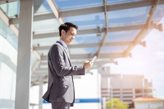 businessman, asian, business, office, computer, laptop, tablet, people, young, worker, professional, suit, technology, person, corporate, executive, white, working, manager, portrait, work, internet, 