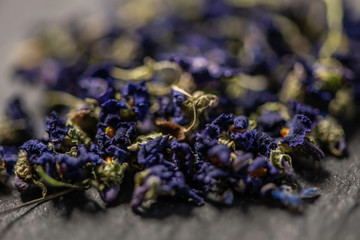 filled frame close up of purple viola violeta odorata dry dried blossom flower heads  tie mixture 