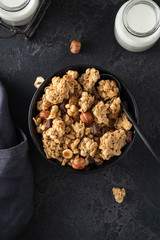 Сhocolate muesli on dark background. Flat lay, top view, close up.