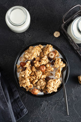 Сhocolate muesli on dark background. Flat lay, top view, close up.