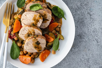Pork with chickpeas and spinach. Copy space.