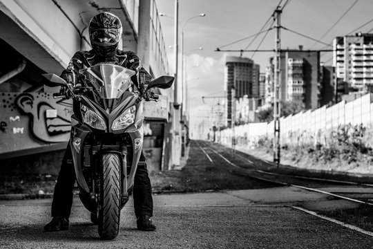 A man on a motorcycle looks great in black and white