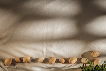 Festive eggs on a wooden table covered with a tablecloth in the morning