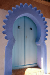 Blue painted house door in city of  Chefchaouen,Morocco.