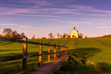 Boardwalk leading to the Isolated St Hubert's Church, South Downs National Park