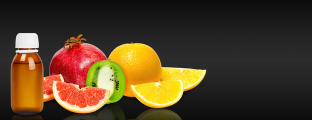 Fototapeta na wymiar Fresh and ripe fruits, orange, kiwi, grapefruit and pomegranate with medical bottle.