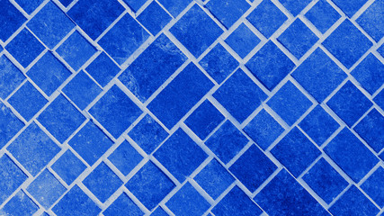 Abstract dark phantom blue concrete cement stone square rectangular cubes texture background ( 45 degrees )