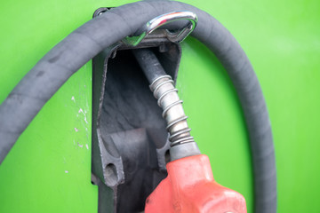 Detail of oil fuel filling nozzles at petrol pump