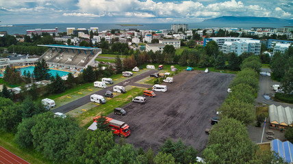 Aerial view of Reykjavik. Sports area with swimming pools, camping sites, footballs, caravans and...