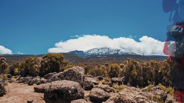 Timelapse view of Kibo with Uhuru Peak (5895m, highest mountain in Africa) at Mount Kilimanjaro, Kilimanjaro National Park. Beautiful landscape with clouds floating over the  volcano.