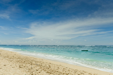A fishing boat anchored in a deserted lagoon in Bali, Indonesia.