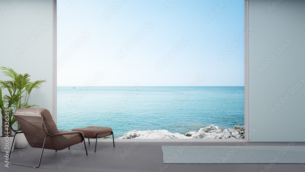 Wall mural Armchair on concrete floor of large living room in modern house or luxury hotel. Minimal home interior 3d rendering with sky and sea view.