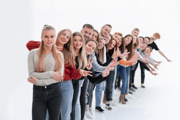 Obraz premium group of cheerful young people standing behind each other