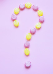 Multicolored candys on a colored background