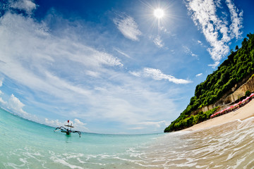 A fishing boat anchored in a deserted lagoon in Bali, Indonesia.