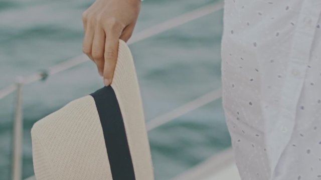 Girl in a white dress standing in wind