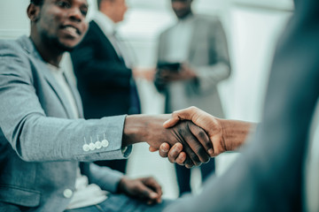 international business colleagues shaking hands with each other