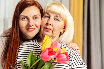 Mother and young daughter are hugging. Happy loving family. Happy mother's day.