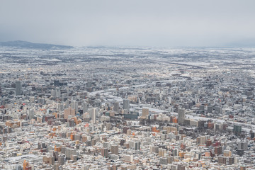 View of Sapporo in Hokkaido, Japan. On a cloudy winter day from the top of Mt Moiwa.