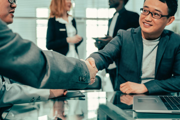 close up. business partners confirm the transaction with a firm