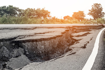 Road collapsed Road subsidence cracking.