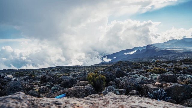 Timelapse view of Kibo with Uhuru Peak (5895m, highest mountain in Africa) at Mount Kilimanjaro, Kilimanjaro National Park. Beautiful landscape with clouds floating over the  volcano.