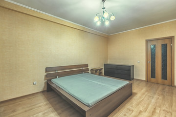 Empty cheap furnished rental room with no decor
