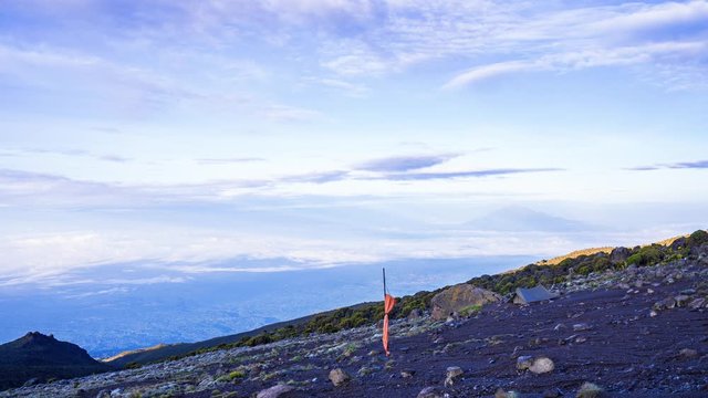 Timelapse view of Kibo with Uhuru Peak (5895m, highest mountain in Africa) at Mount Kilimanjaro, Kilimanjaro National Park. Beautiful landscape with clouds floating over the  volcano.