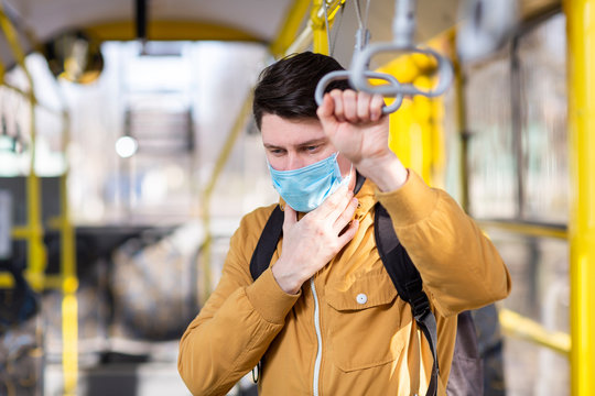 Man With Surgical Mask In Public Transport