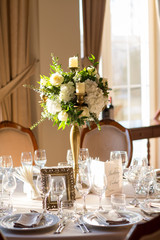 Beautiful decoration for special event. Bouquet of flowers on table