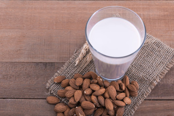 almond milk in a glass on the wood