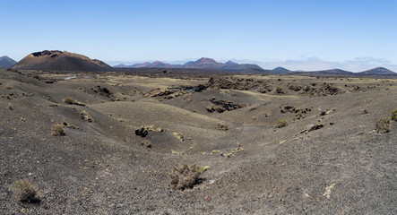 Fototapeta na wymiar Lava fields and desert landscape in Lanzarote
