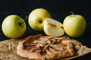Gallet with apples on a black background. Seasonal dishes. Diet Baking